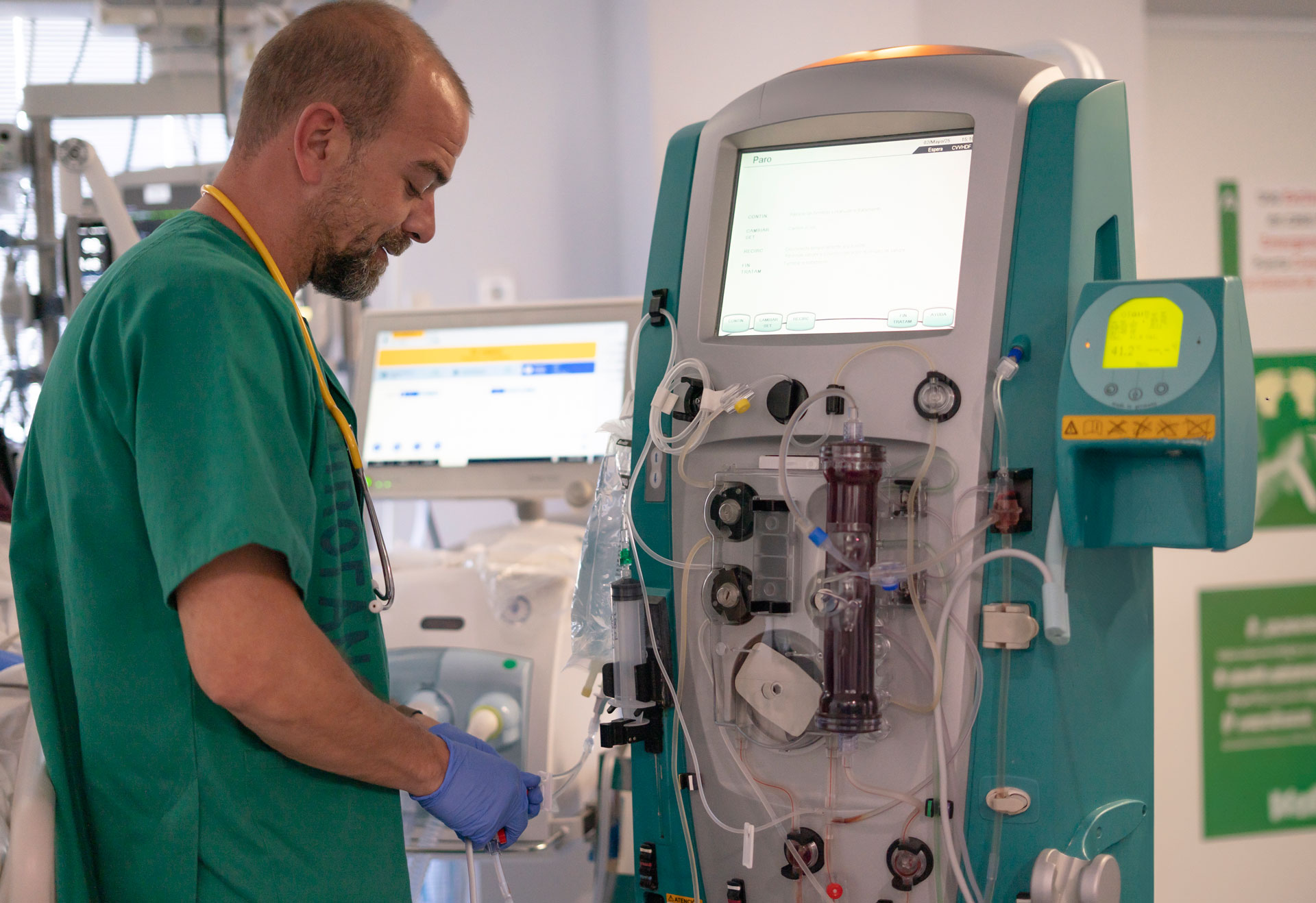 Dialysis technician operating hemodialysis machine at Cadia Rehabilitation
